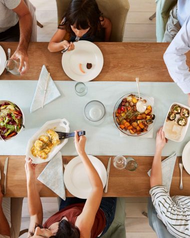 three-generation-white-family-sitting-at-a-dinner-2023-11-27-05-20-23-utc_11zon